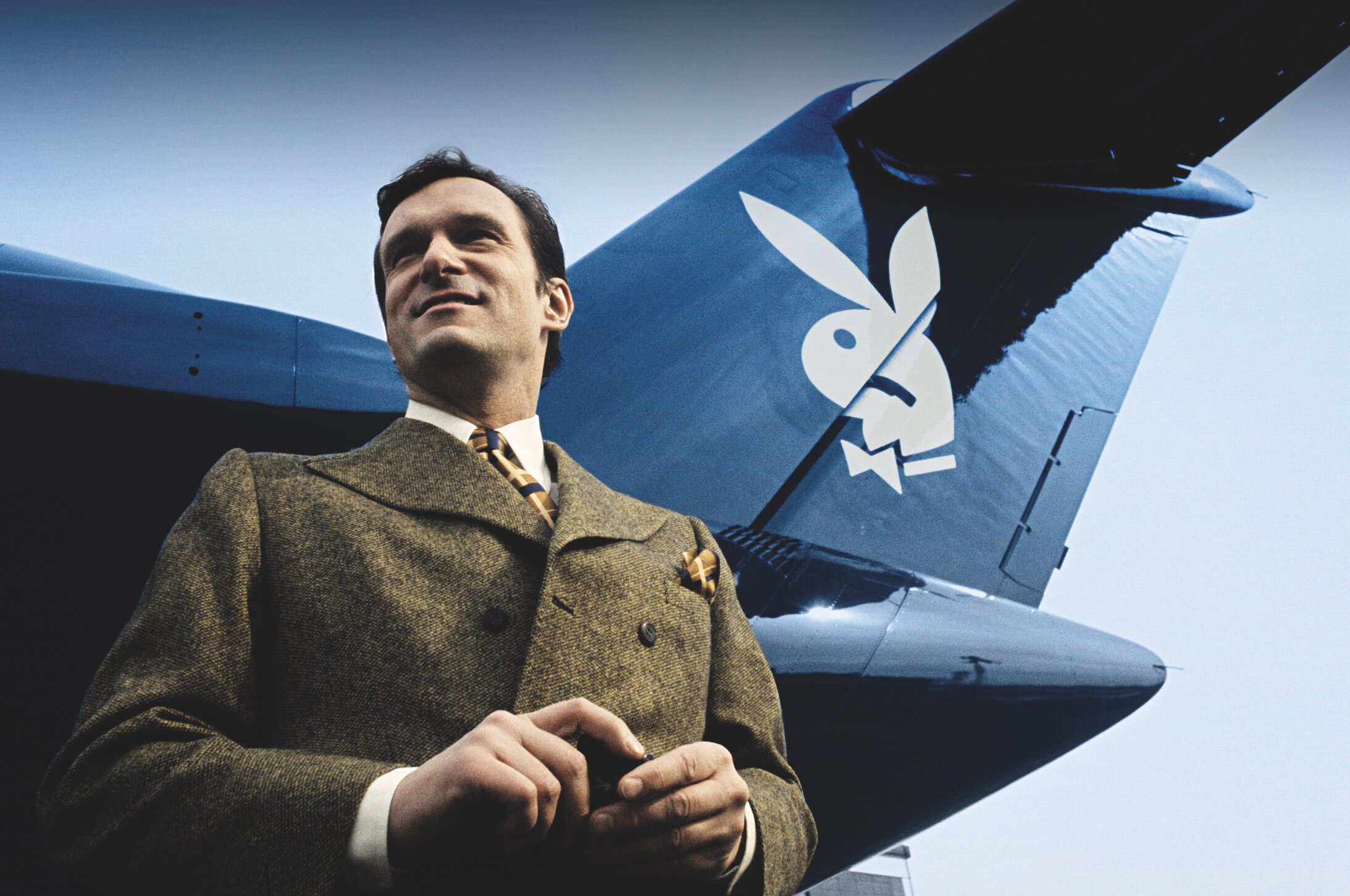 A young Hugh Hefner, the founder and EIC of Playboy magazine, by a Playboy plane